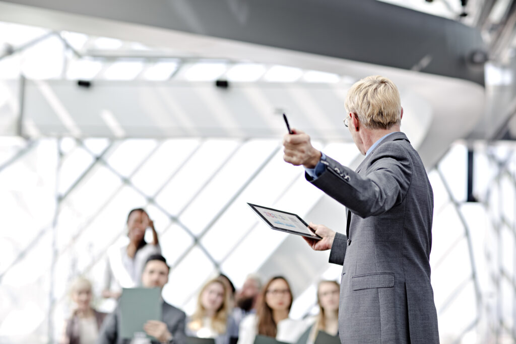 man speaking at seminar